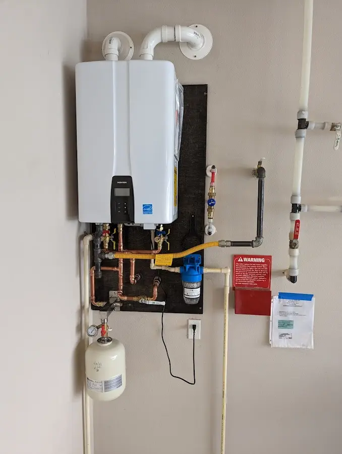 Professional plumber installing copper piping in a Apopka home